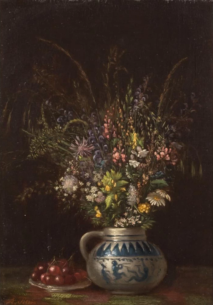 Bouquet di fiori di campo accanto ad un piatto pieno di ciliegie
